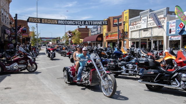 Bikers ride down Main Street during the 80th annual Sturgis Motorcycle Rally.