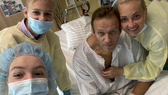 Russian opposition leader Alexei Navalny sits up in his hospital bed in Germany.