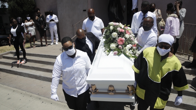 LA: Pall bearers carry a casket with the body of Lydia Nunez, who died from COVID-19.