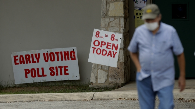 Man walks away from early voting location.