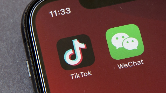 Icons for the smartphone apps TikTok and WeChat are seen on a smartphone screen