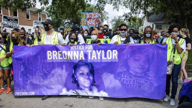 Protesters participate in the Good Trouble Tuesday march for Breonna Taylor in Louisville, Ky.