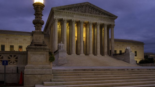U. S. Supreme Court building stands quietly before dawn in Washington.