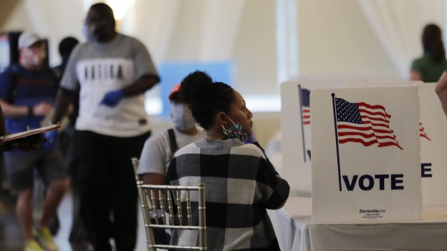 People wait to vote in Georgia's primary election at Park Tavern in Atlanta, GA