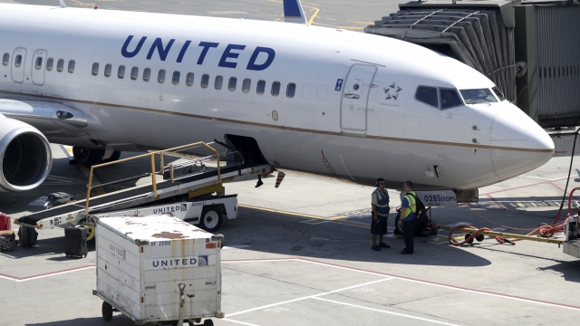 A United Airlines commercial jet sits at a gate at Terminal C of Newark Liberty International Airport in Newark, N.J.