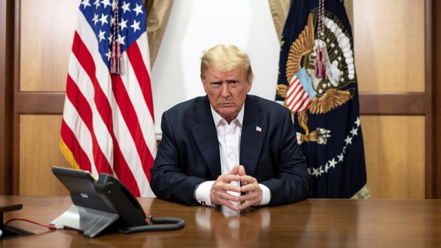 President Donald Trump listens during a phone call in his conference room at Walter Reed National Military Medical Center.