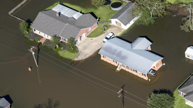 Houses surrounded by flood waters are seen in the aftermath of Hurricane Delta Saturday Oct. 10, 2020, in Welsh, LA