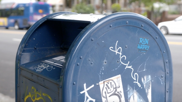 A blue mail collection box