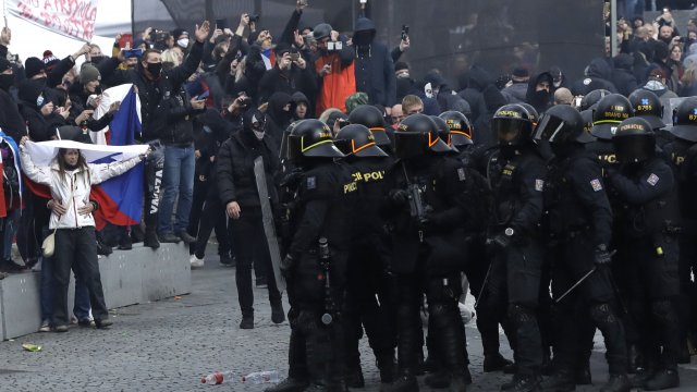 Police clash with protesters at the Old Town Square in Prague, Czech Republic, Sunday, Oct. 18, 2020.