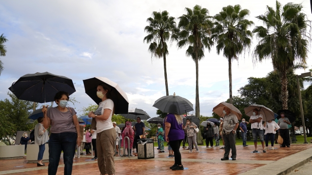 Voters line up in the rain at Miami polling place