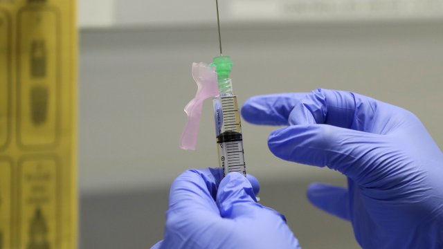 Ajithkumar Sukumaran prepares the COVID-19 vaccine to administer to a volunteer, at a clinic in London. U.K.
