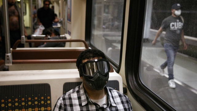 Ehab Hassanin opts formaximum protection while riding while riding a Metro Rail train in Los Angeles in July.