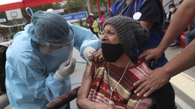 A woman gets an influenza vaccine