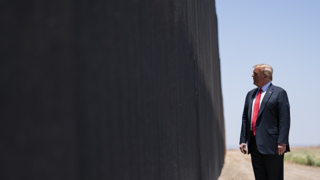 In this June 23, 2020, file photo, President Donald Trump tours a section of the border wall in San Luis, Ariz.