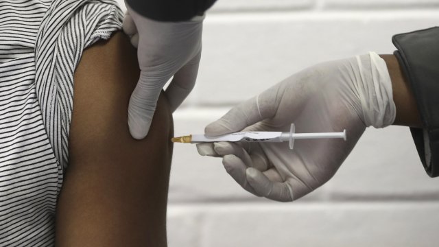 Volunteer receives injection