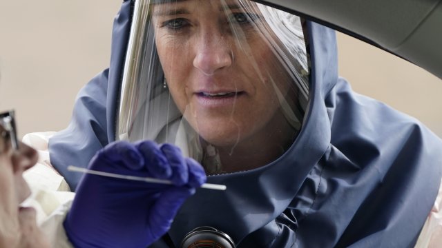 Nurse performs coronavirus test