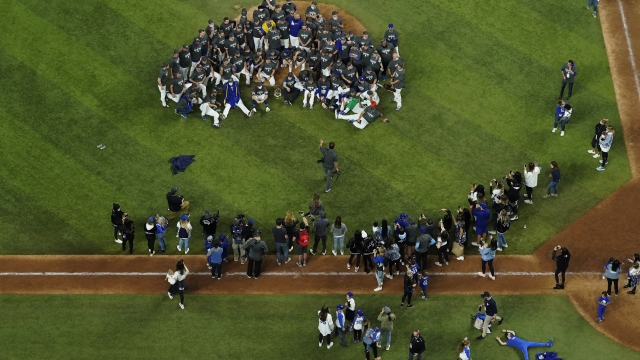 Los Angeles Dodgers pose for a group photo after defeating the Tampa Bay Rays 3-1 to win the baseball World Series in Game 6