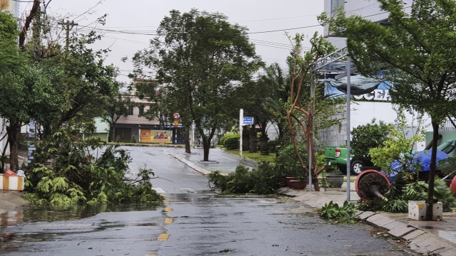 Broken tree branches caused by strong winds from typhoon Molave lie on a deserted street in Da Nang, Vietnam Wednesday