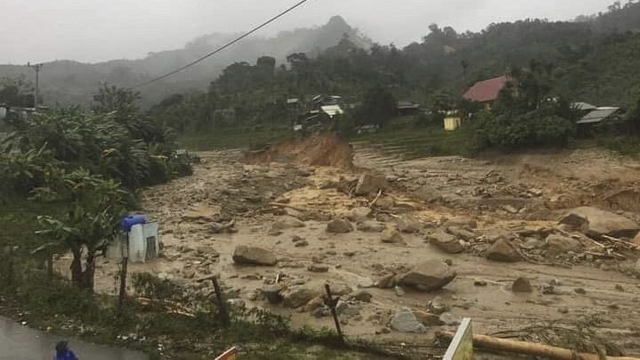 A landslide leaves a trail of rocks and mud as it swamps a village in Phuoc Loc district, Quang Nam province, Vietnam