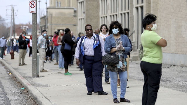 A line of voters wraps around the block outside a high school in Milwaukee, Wisconsin
