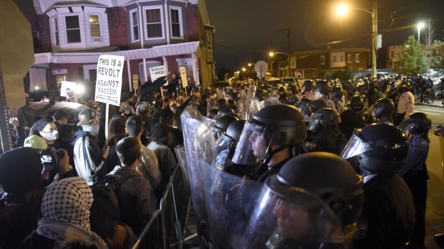 Protesters face off with police during a demonstration Tuesday, Oct. 27, 2020
