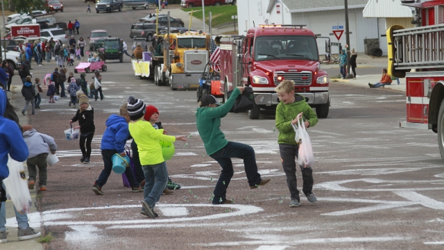 Children scramble for candy during a homecoming parade on Friday Oct. 16, 2020, in Wessington Springs, S.D.
