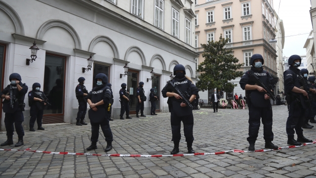 Police officers guard the scene in Vienna, Austria, Tuesday, Nov. 3, 2020.