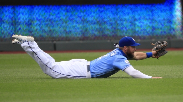 Kansas City Royals left fielder Alex Gordon lays out to catch a fly ball.