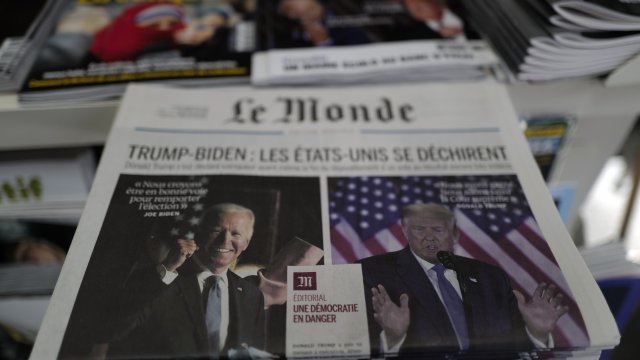 A pile of French newspaper 'Le Monde' headlines "Trump-Biden : the United States is tearing itself apart"