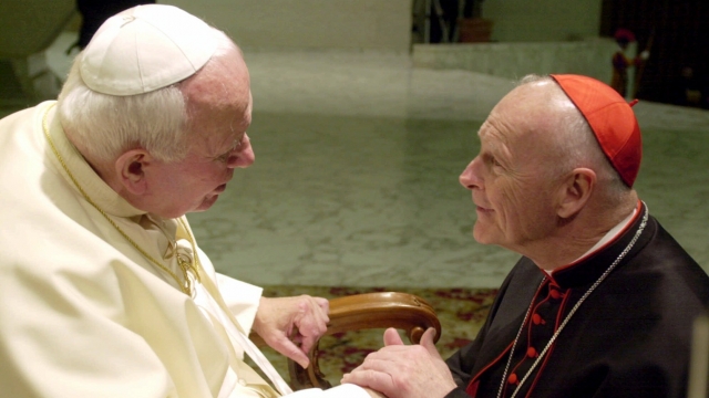 U.S. Cardinal Theodore Edgar McCarrick, archbishop of Washington, D.C., shakes hands with Pope John Paul II in 2001.