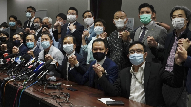 Hong Kong's pro-democracy legislators pose for a photo before a press conference at Legislative Council in Hong Kong.
