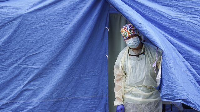 Medical worker operates a testing tent at a COVID-19 mobile testing site in New York City