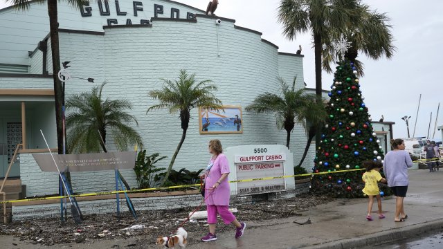 The Gulfport Casino is cordoned off as debris covers the sidewalk in the aftermath of Tropical Storm Eta