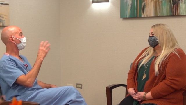 Bariatric surgeon Dr. Michael Snyder meets with patient Amanda Kines-Phillips.