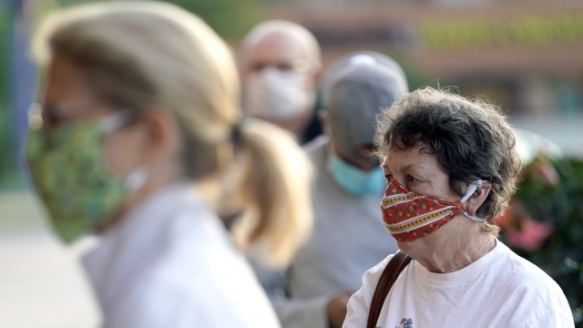 Shoppers wear face masks, to help prevent the spread of COVID-19.