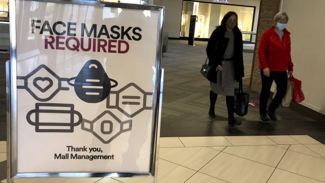 "Face masks required" sign at mall