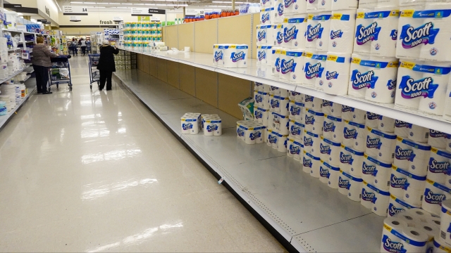 Shelves in the paper towel and toilet paper section are depleted at a Meijer Store in Carmel, Ind., Tuesday, Nov. 17, 2020.