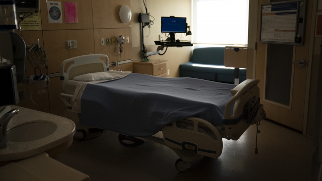 An unoccupied hospital bed is seen in a COVID-19 unit at Providence Holy Cross Medical Center in Los Angeles.