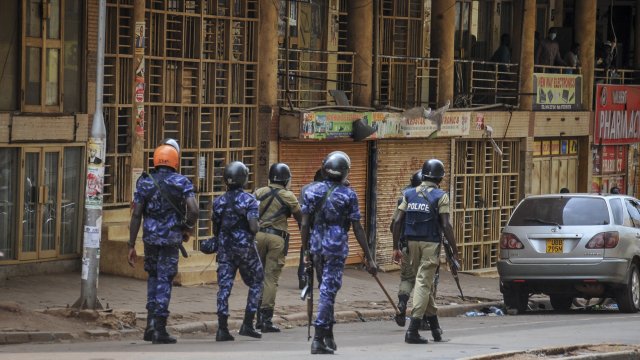 Ugandan security forces patrol a street