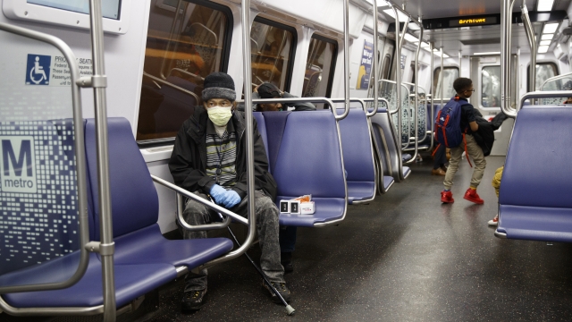 Passengers ride a Washington D.C. metro train