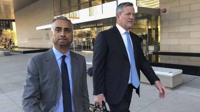 Imaad Zuberi, left, leaves the federal courthouse with his attorney Thomas O'Brien, right, in Los Angeles.