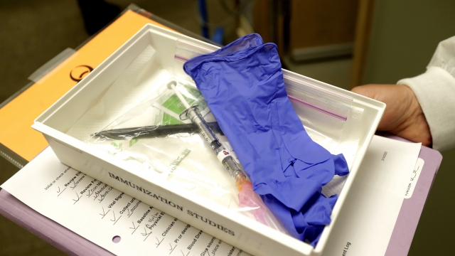 A tray with a syringe containing a shot that will be used in the first clinical trial of a potential Covid-19 vaccine.