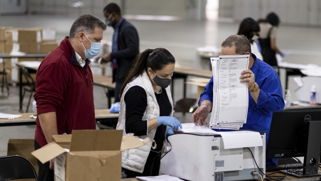 Workers in Fulton County, Georgia, count ballots during the presidential election recount