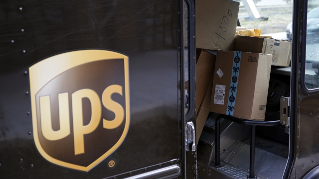 Packages overflowing inside a UPS delivery truck.