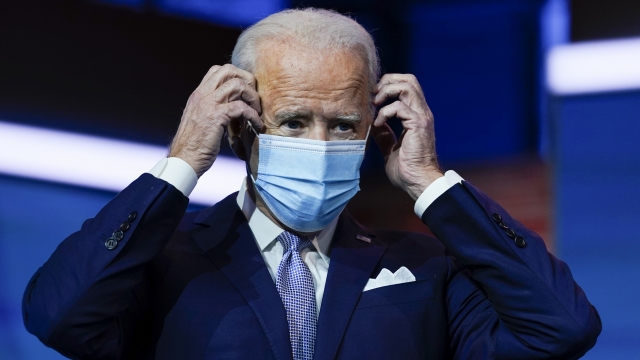 President-elect Joe Biden puts on his face mask.