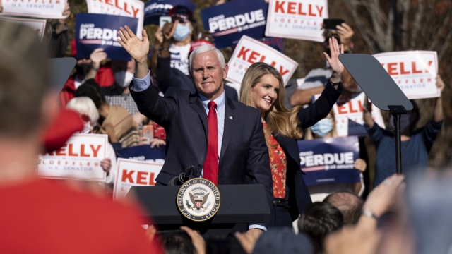 Vice President Mike Pence and Kelly Loeffler wave to the crowd in Georgia.