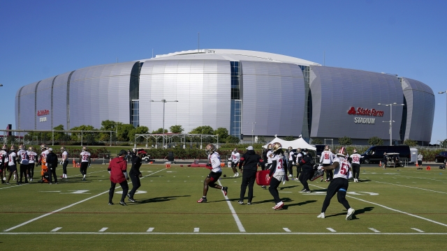 The San Francisco 49ers NFL football team defensive unit runs drills outside State Farm Stadium in Glendale, Arizona