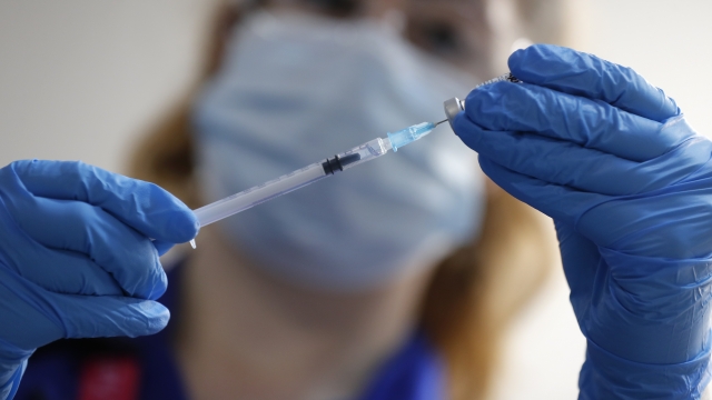 A nurse prepares a shot of the Pfizer-BioNTech COVID-19 vaccine