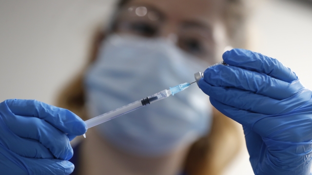 A nurse prepares a shot of the Pfizer-BioNTech COVID-19 vaccine