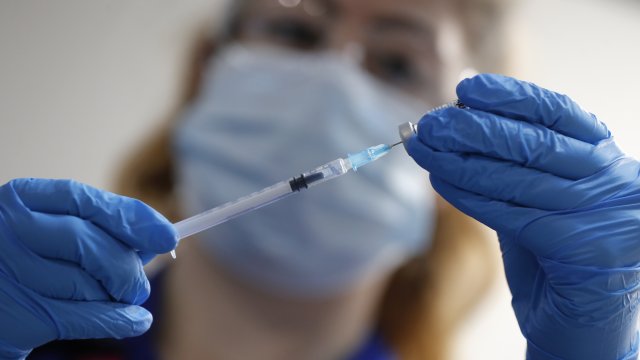 A nurse prepares a shot of the Pfizer-BioNTech COVID-19 vaccine.